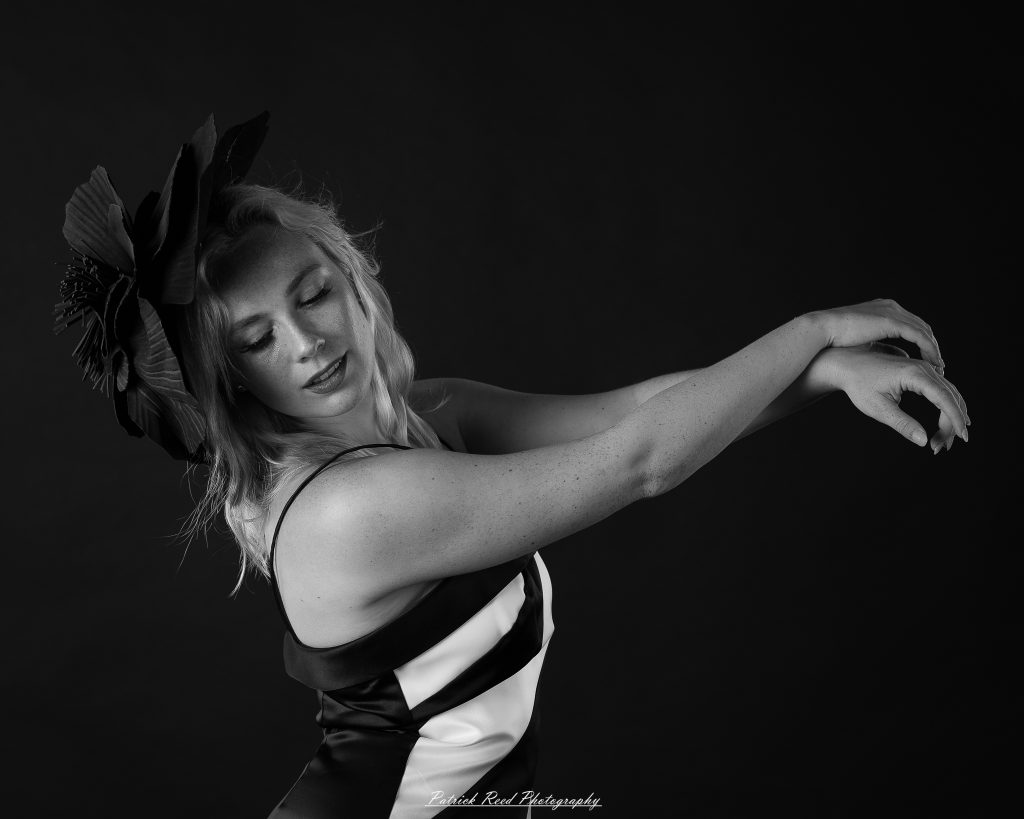 Studio fashion photography featuring model Hannah in avant-garde headwear, contemporary fashion styling, and retro-inspired editorial portraits captured with dramatic lighting and expressive posing.