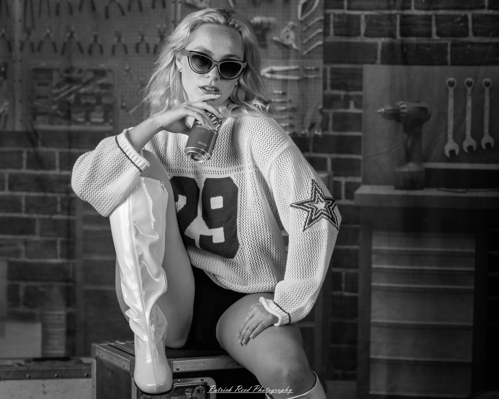 Studio fashion photography featuring model Hannah in avant-garde headwear, contemporary fashion styling, and retro-inspired editorial portraits captured with dramatic lighting and expressive posing.