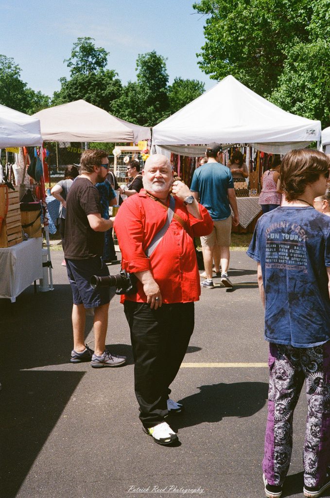 Street photography captured on a Rollei 35S at Peacefest in Waterford, Michigan, featuring festival attendees, live entertainment, community activities, and candid moments documented on 35mm film.