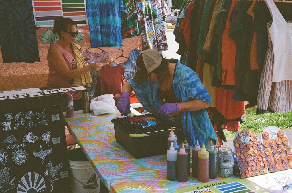 Street photography captured on a Rollei 35S at Peacefest in Waterford, Michigan, featuring festival attendees, live entertainment, community activities, and candid moments documented on 35mm film.