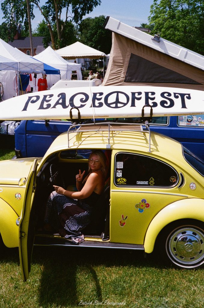 Street photography captured on a Rollei 35S at Peacefest in Waterford, Michigan, featuring festival attendees, live entertainment, community activities, and candid moments documented on 35mm film.