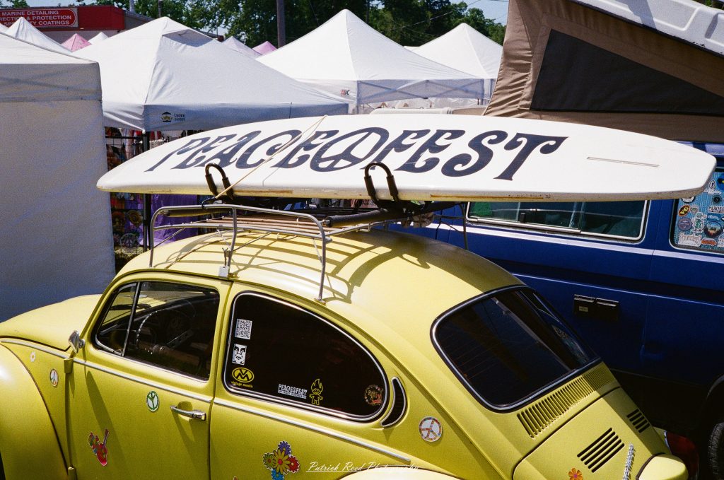 Street photography captured on a Rollei 35S at Peacefest in Waterford, Michigan, featuring festival attendees, live entertainment, community activities, and candid moments documented on 35mm film.
