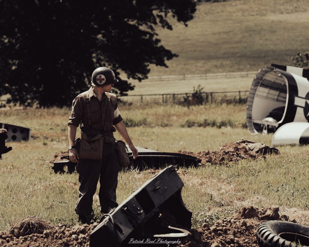 Documentary photographs of World War II reenactors at the Steam Railroading Institute, featuring authentic military uniforms, vintage trains, historical equipment, and living history demonstrations.