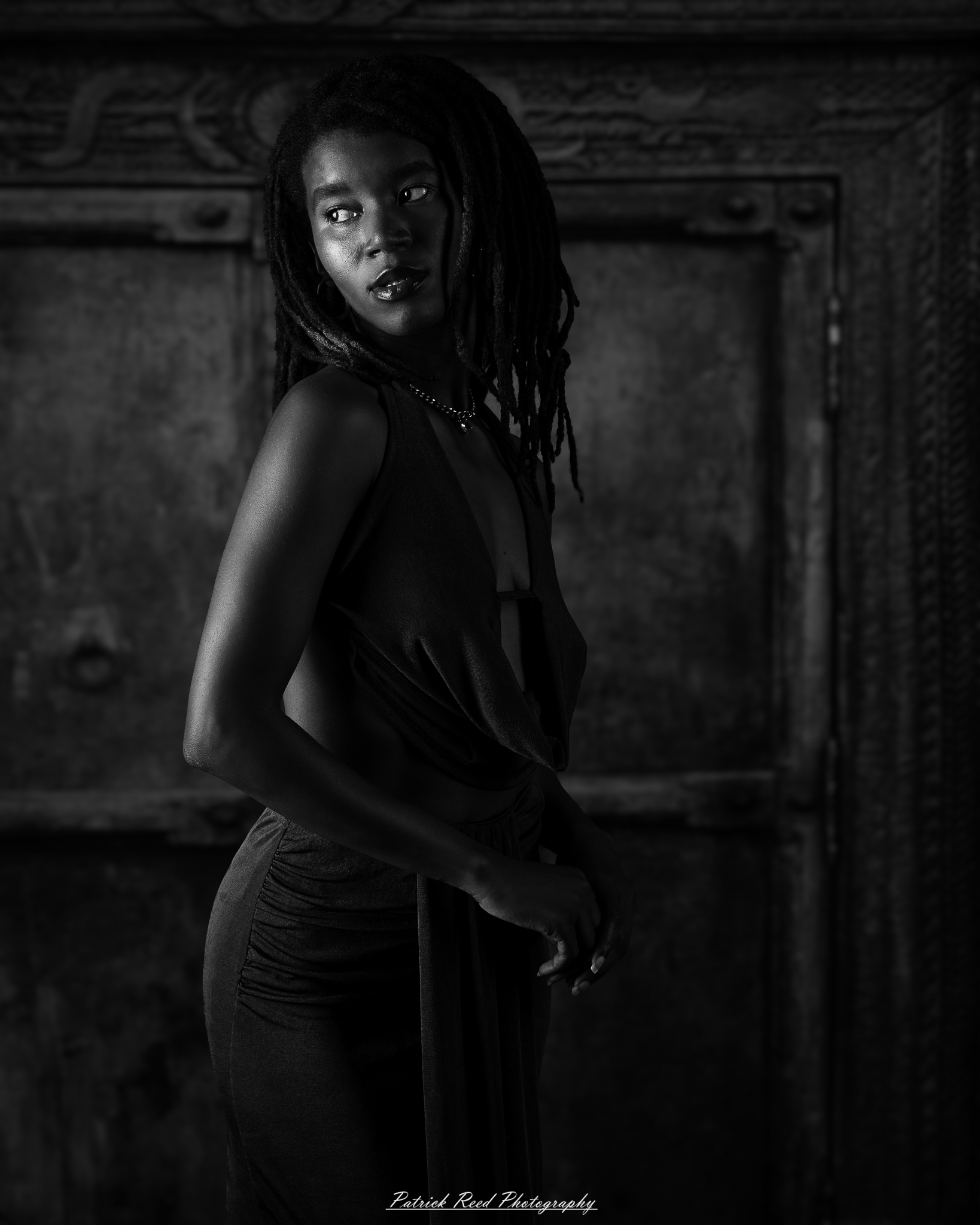 Studio editorial portraits featuring model Deja with dramatic lighting, fine-art black-and-white photography, contemporary fashion, and creative portraiture captured in a Detroit-area photography studio.