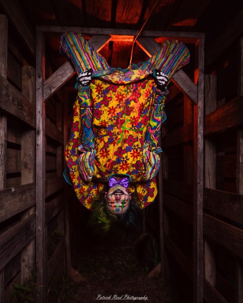 Spooky night photography at Scarefest Haunted Park in Michigan, featuring eerie lighting, haunted attractions, and Halloween-themed performers.