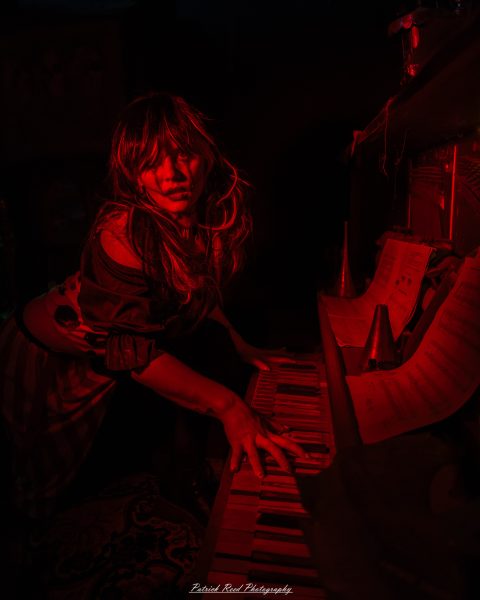 Spooky night photography at Scarefest Haunted Park in Michigan, featuring eerie lighting, haunted attractions, and Halloween-themed performers.